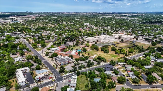 an aerial view of residential houses with outdoor space