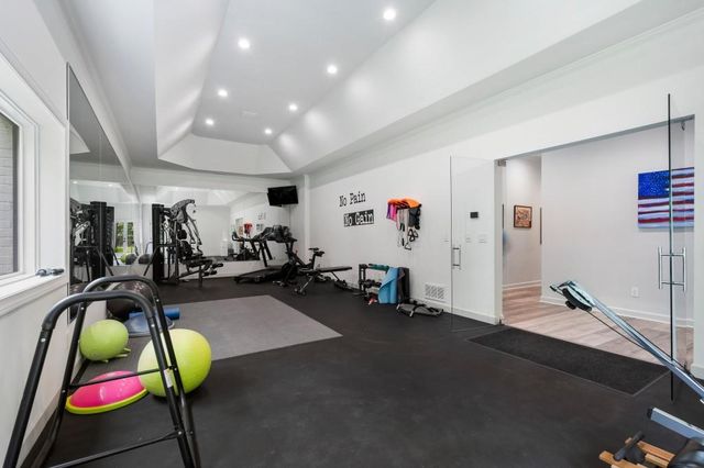 a view of a patio with couches table and chairs and potted plants