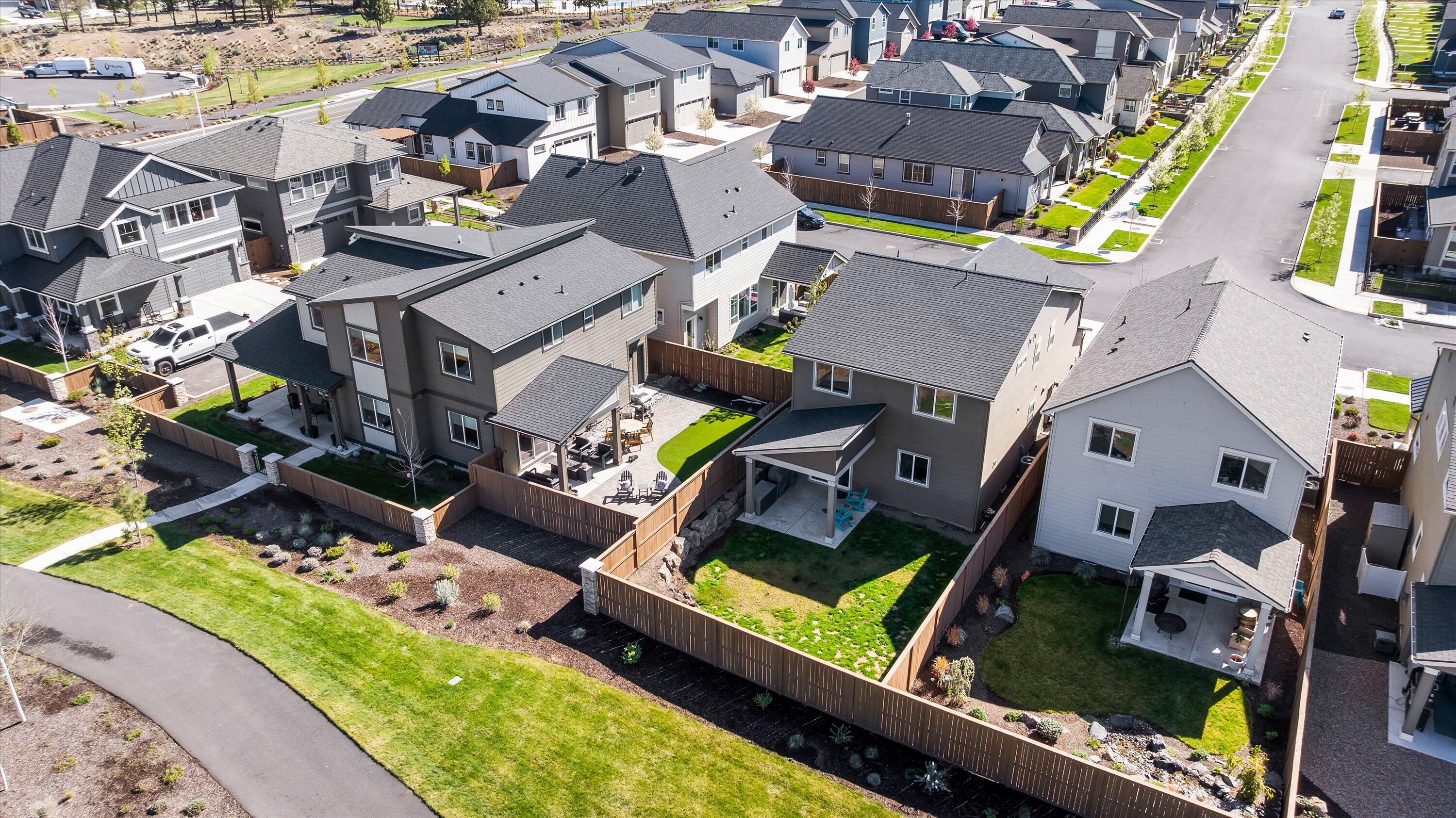 60903 Southeast Epic Place Bend, OR 97702 - Photo 36 of 48 an aerial view of a house with a garden and lake view