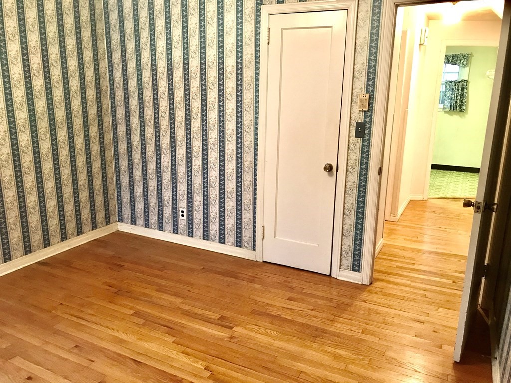 66 Burnside Terrace Springfield, MA 01118 - Photo 13 of 29 a view of an empty room with wooden floor
