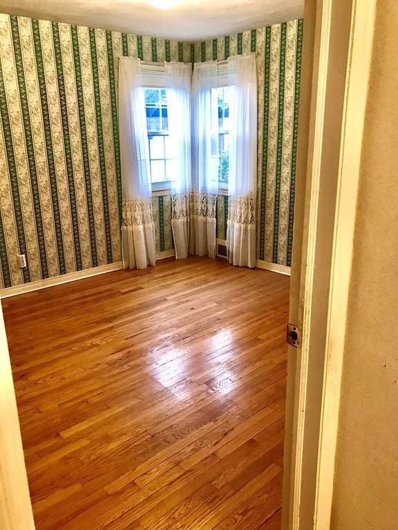 66 Burnside Terrace Springfield, MA 01118 - Photo 16 of 29 a view of a room with wooden floor and windows