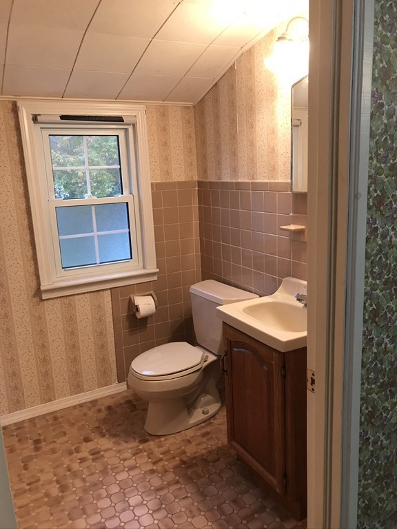 66 Burnside Terrace Springfield, MA 01118 - Photo 22 of 29 a bathroom with a toilet a sink and a window