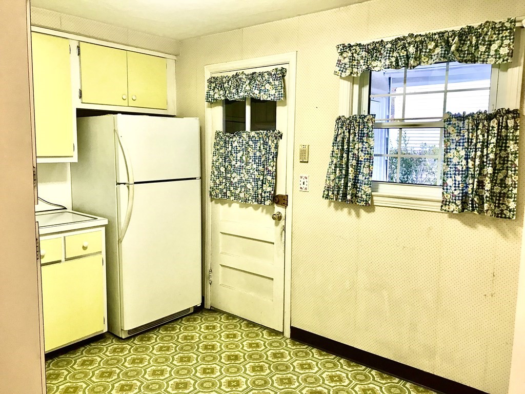 66 Burnside Terrace Springfield, MA 01118 - Photo 9 of 29 a view of a living room with a refrigerator