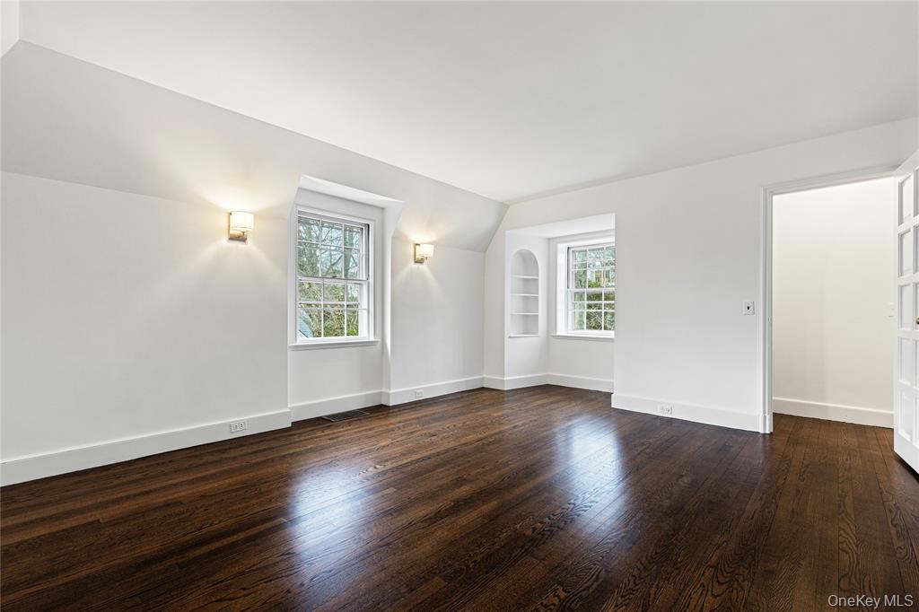 6 Fox Meadow Road Scarsdale, NY 10583 - Photo 13 of 20 Second floor bedroom and dark wood-style floors, and built in features