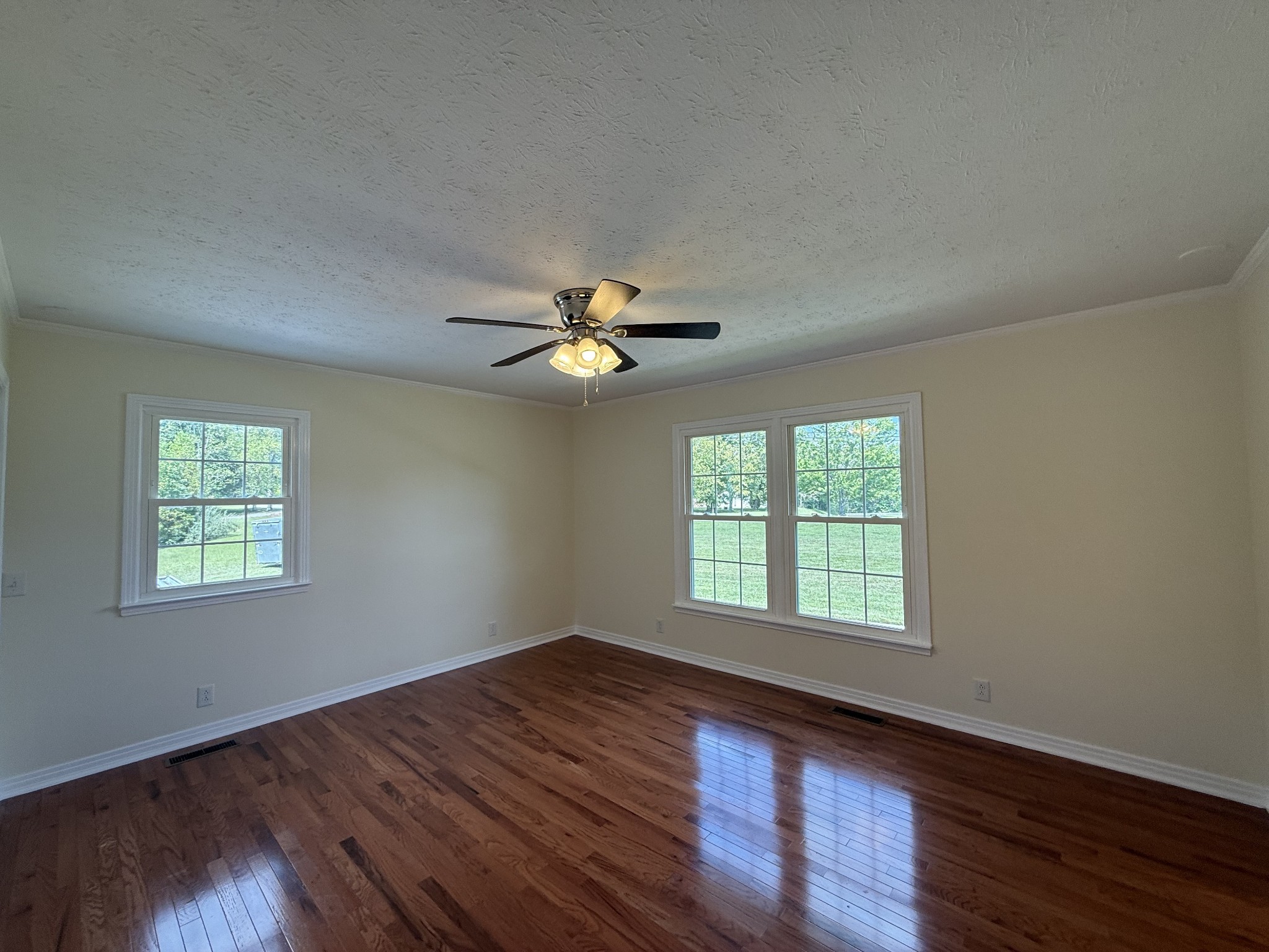 244 James Stafford Road Gainesboro, TN 38562 - Photo 17 of 39 a view of an empty room with wooden floor and a window