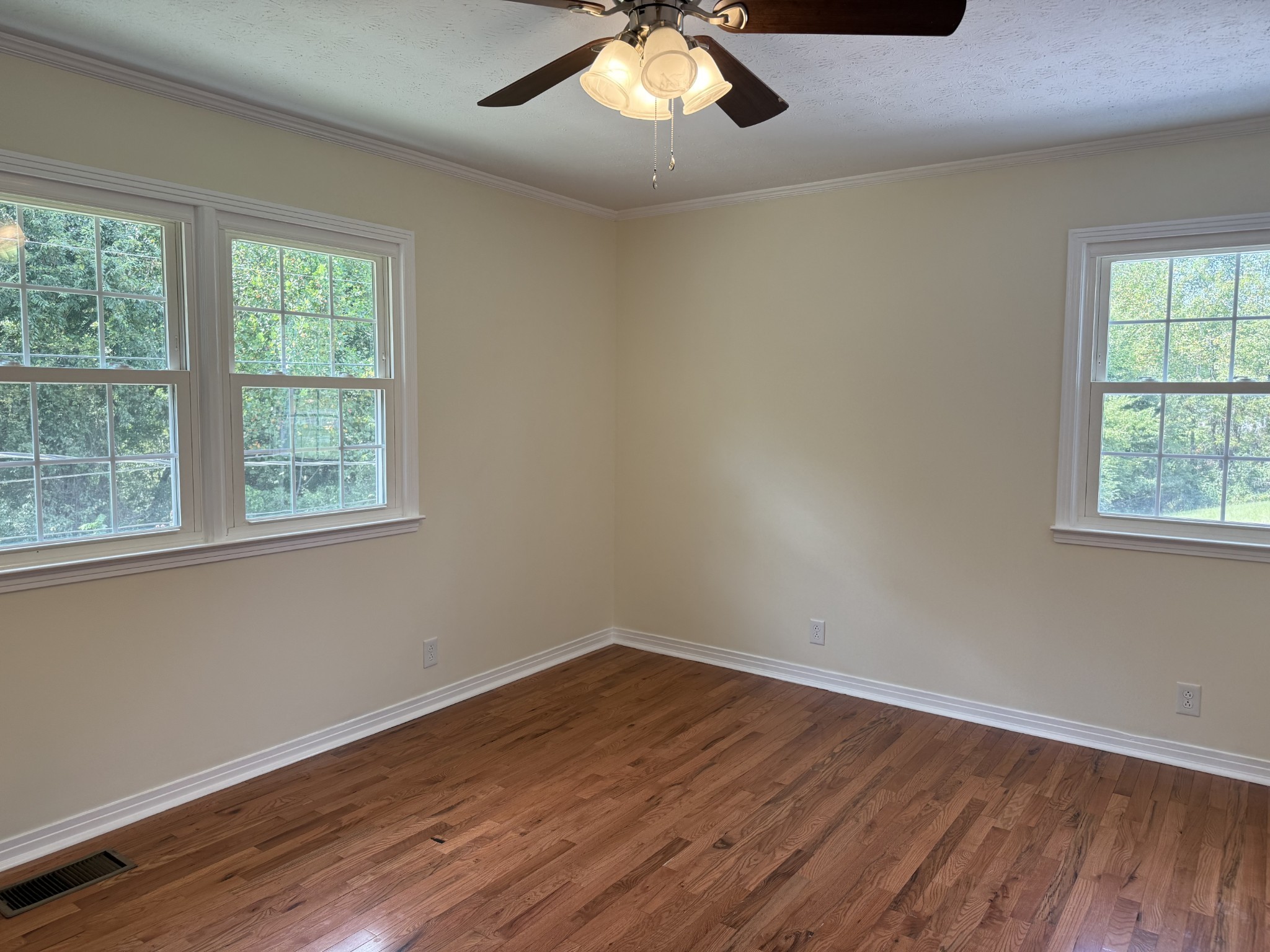 244 James Stafford Road Gainesboro, TN 38562 - Photo 29 of 40 a view of an empty room with wooden floor and a window