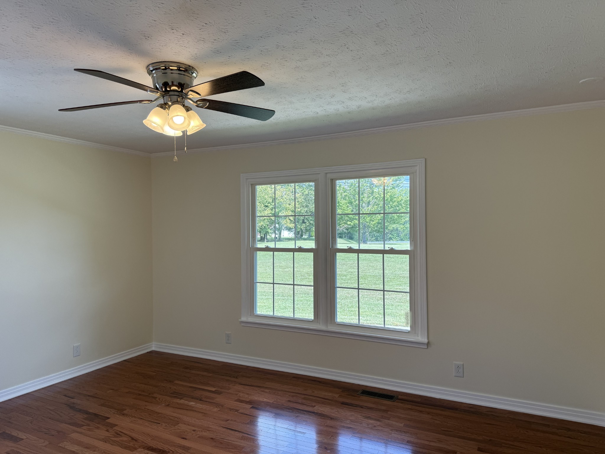 244 James Stafford Road Gainesboro, TN 38562 - Photo 31 of 40 a view of an empty room with wooden floor and a window