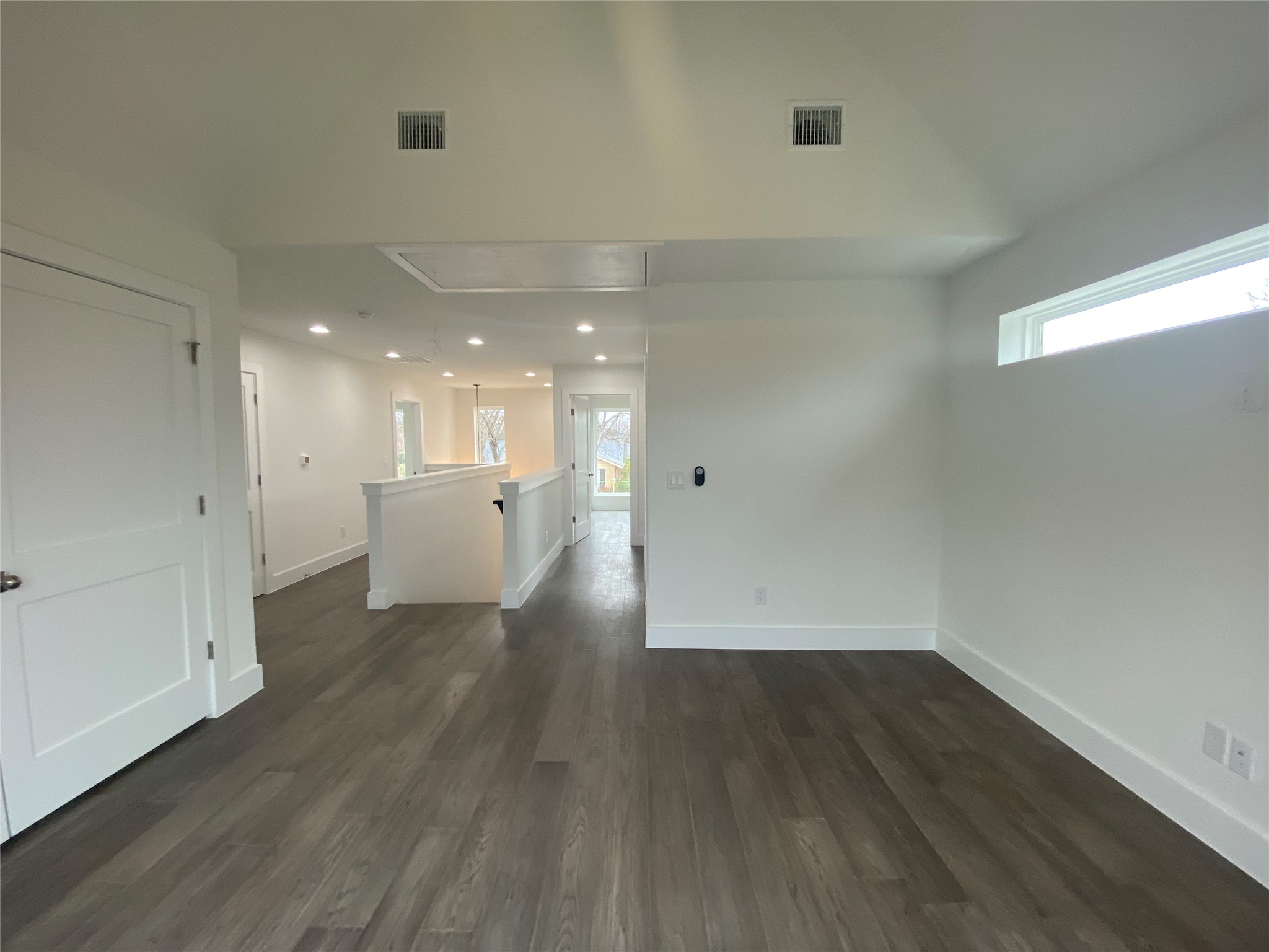 1916 Webberville Road, Unit B Austin, TX 78721 - Photo 14 of 25 Expansive interior space featuring wood-finish flooring, recessed lighting, and a white interior color palette