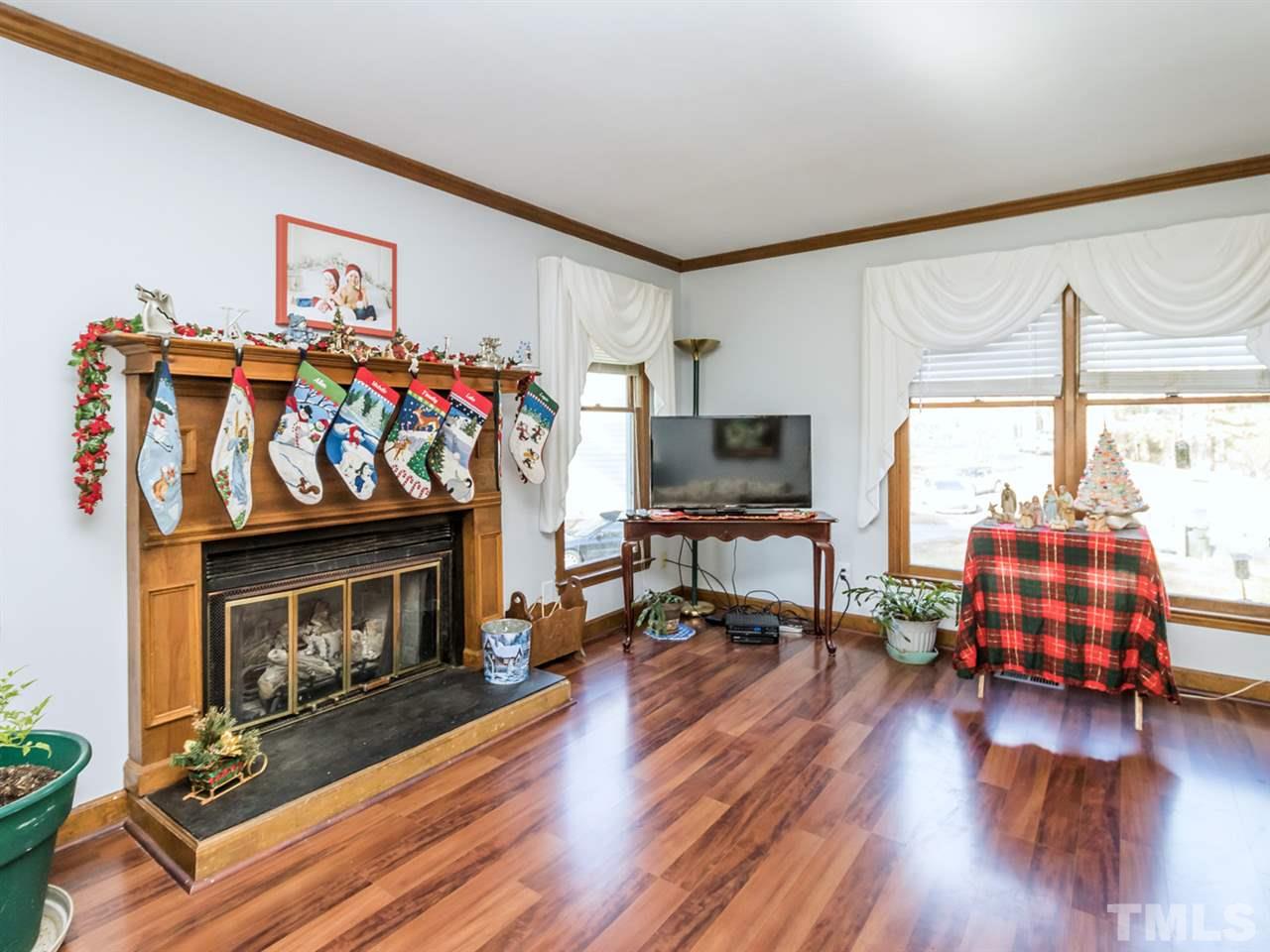 4501 Cobbler Place Raleigh, NC 27613 - Photo 3 of 25 a living room with furniture and a wooden floor