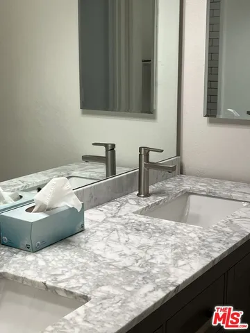 a bathroom with sink and granite