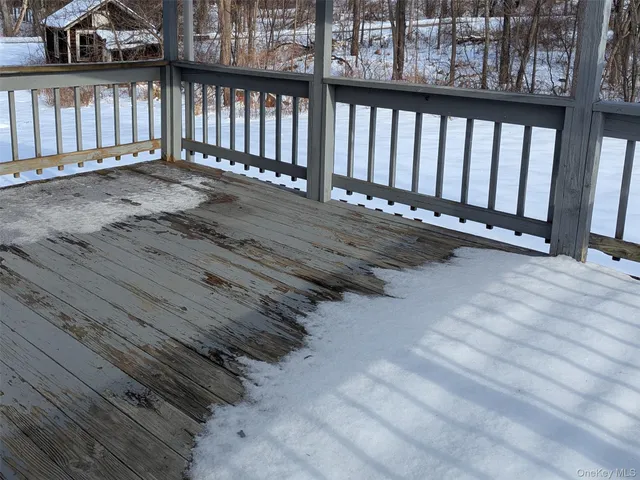 a view of snow on the road