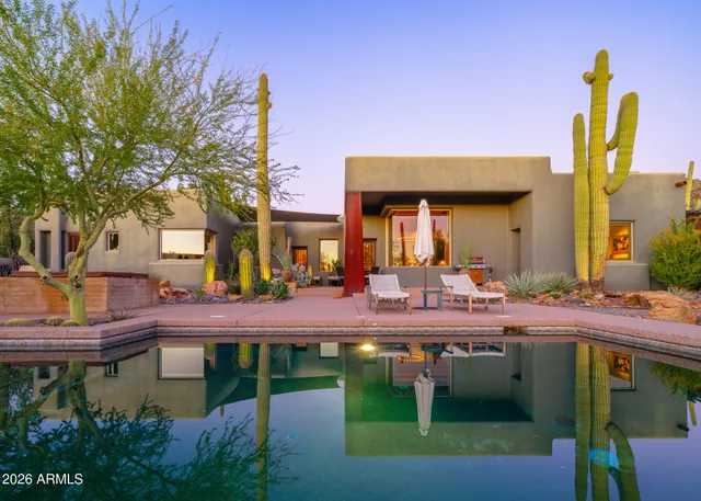 a view of house with a swimming pool