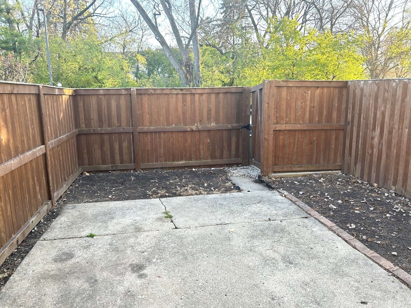 1776 Hassell Road Hoffman Estates, IL 60169 - Photo 22 of 23 a view of backyard with wooden fence