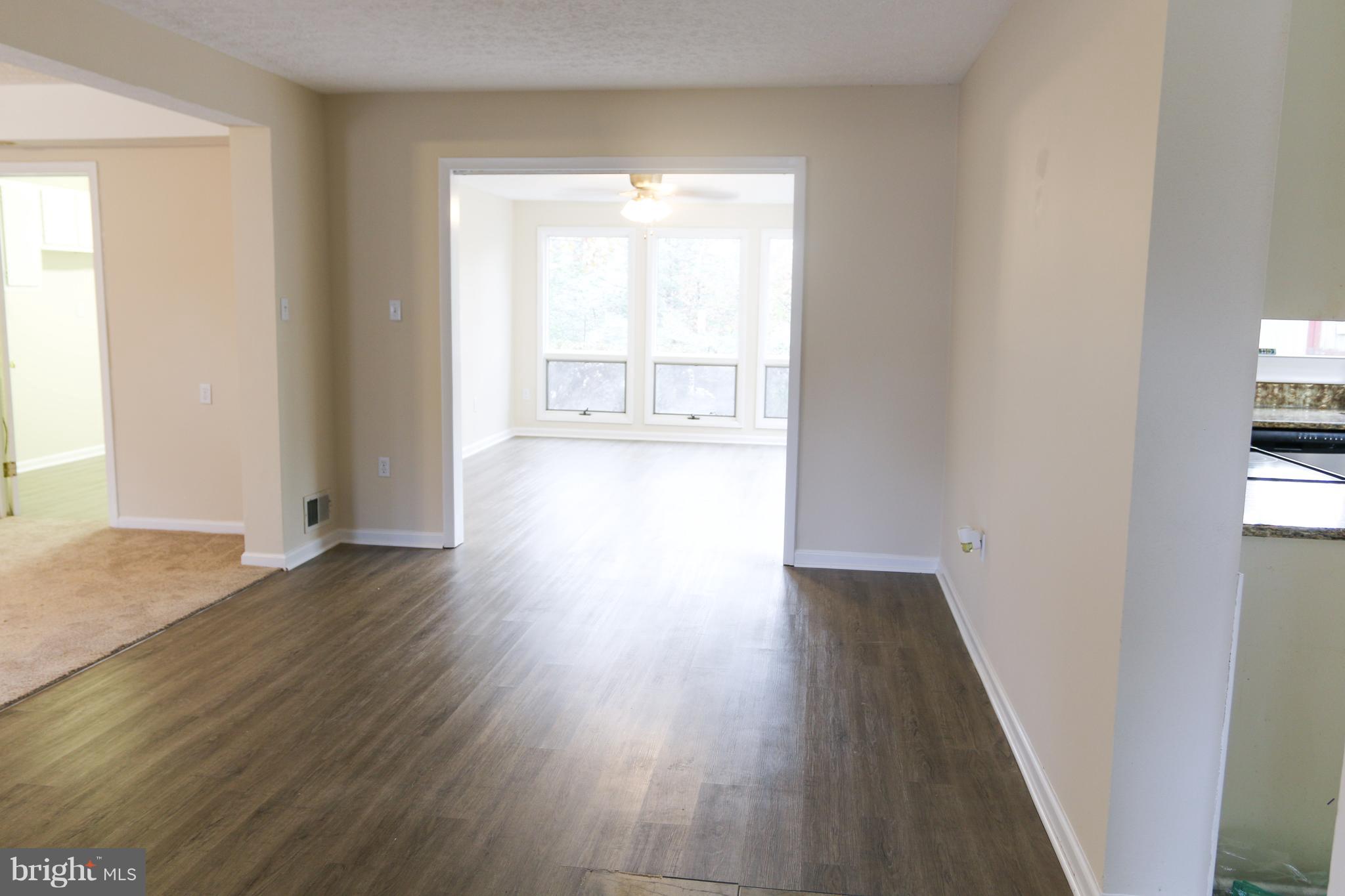 912 Fall Ridge Way Gambrills, MD 21054 - Photo 8 of 31 Family room opens to sun room
