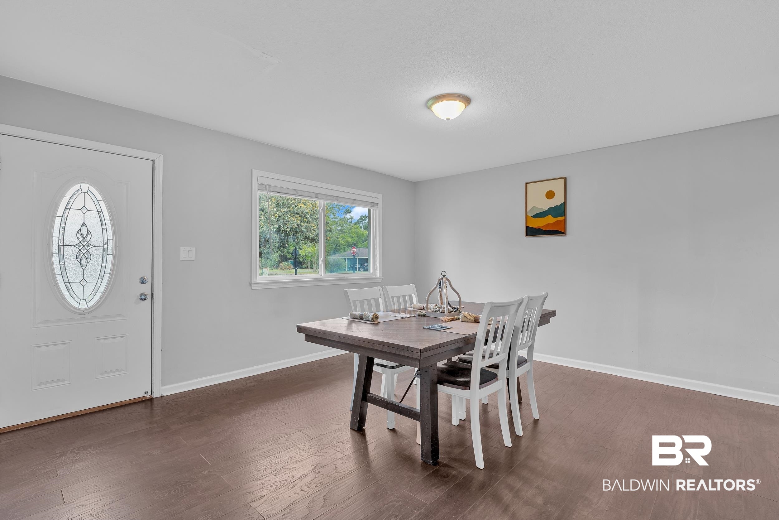 206 West Jackson Avenue Summerdale, AL 36580 - Photo 17 of 37 Dining room featuring dark wood-style floors and baseboards
