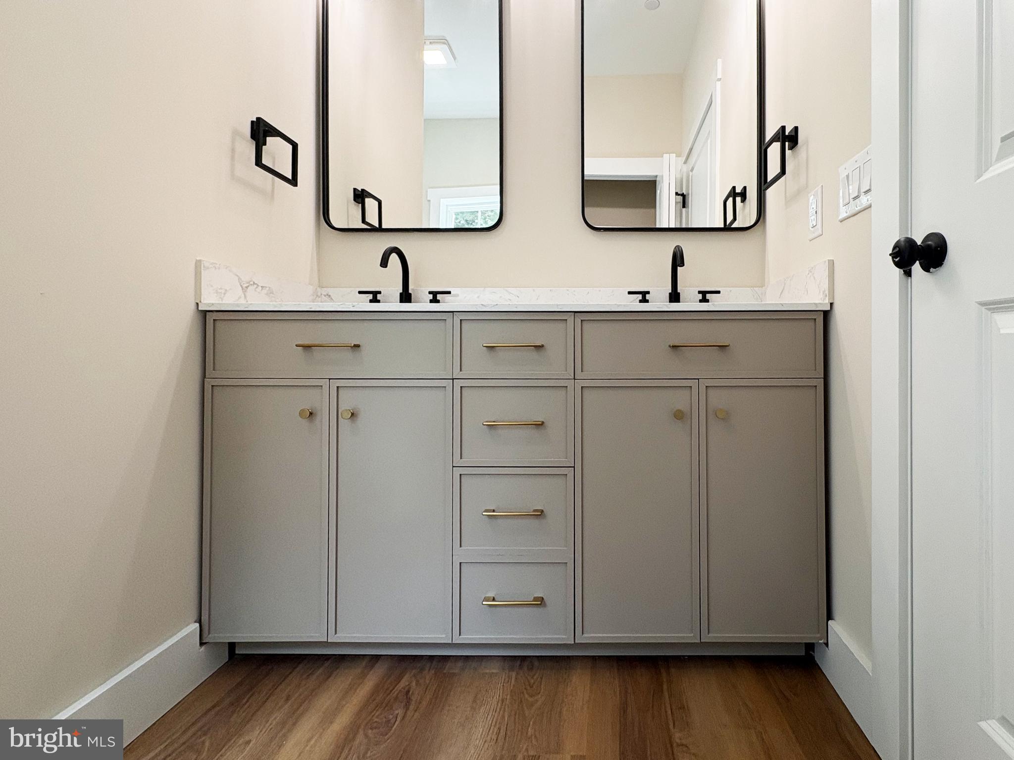 Clark Corner Road Centreville, MD 21617 - Photo 18 of 43 a bathroom with a sink and a mirror