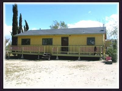 4375 Del Rosa Road Phelan, CA 92371 - Photo 1 of 1 a view of a house with a yard