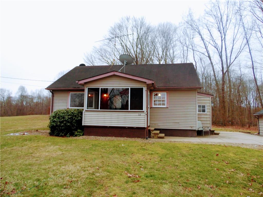 497 Tanglewood Road Pulaski, PA 16143 - Photo 1 of 20 a front view of a house with a yard