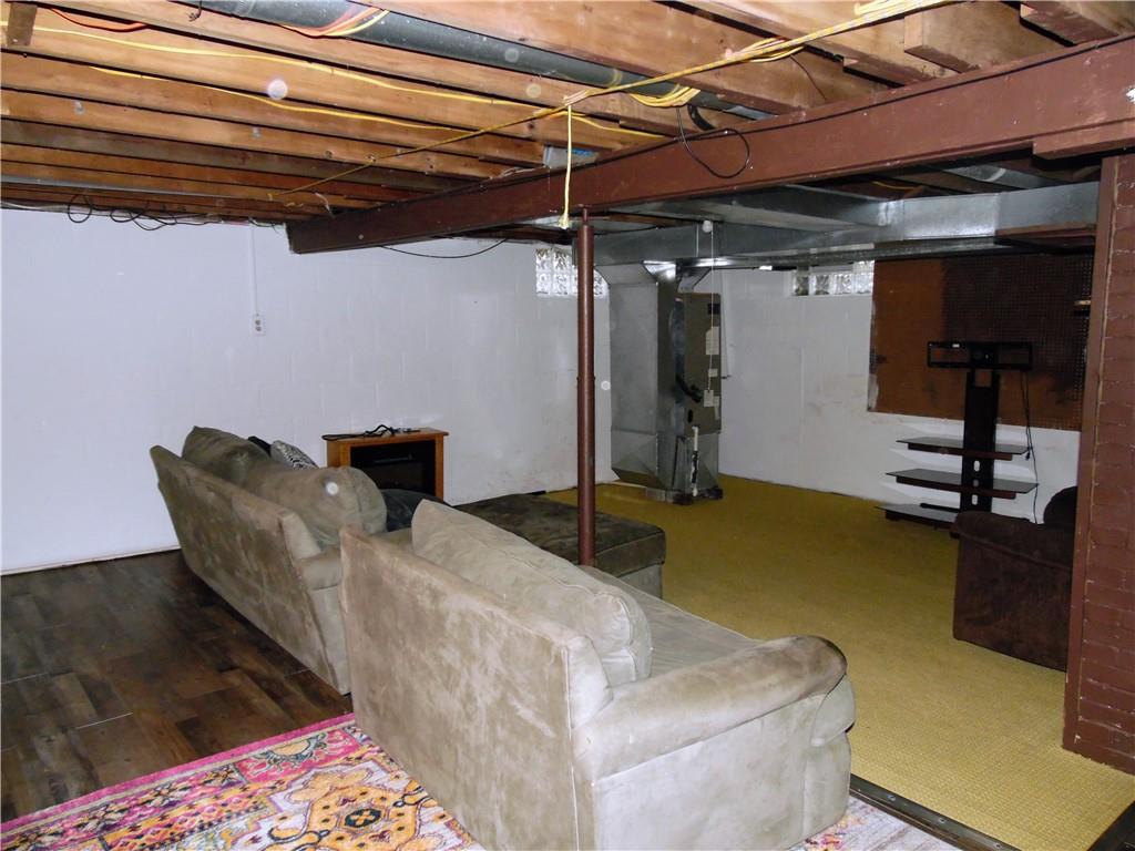 497 Tanglewood Road Pulaski, PA 16143 - Photo 14 of 20 a bed room with a bed and a chair
