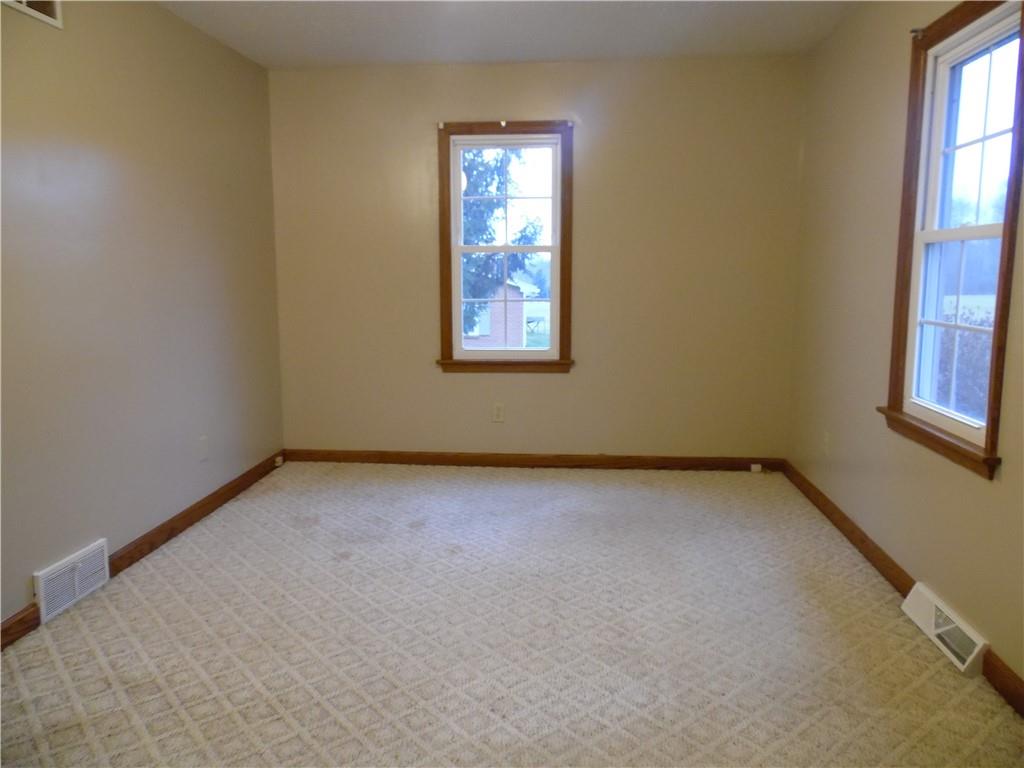 497 Tanglewood Road Pulaski, PA 16143 - Photo 6 of 20 an empty room with windows