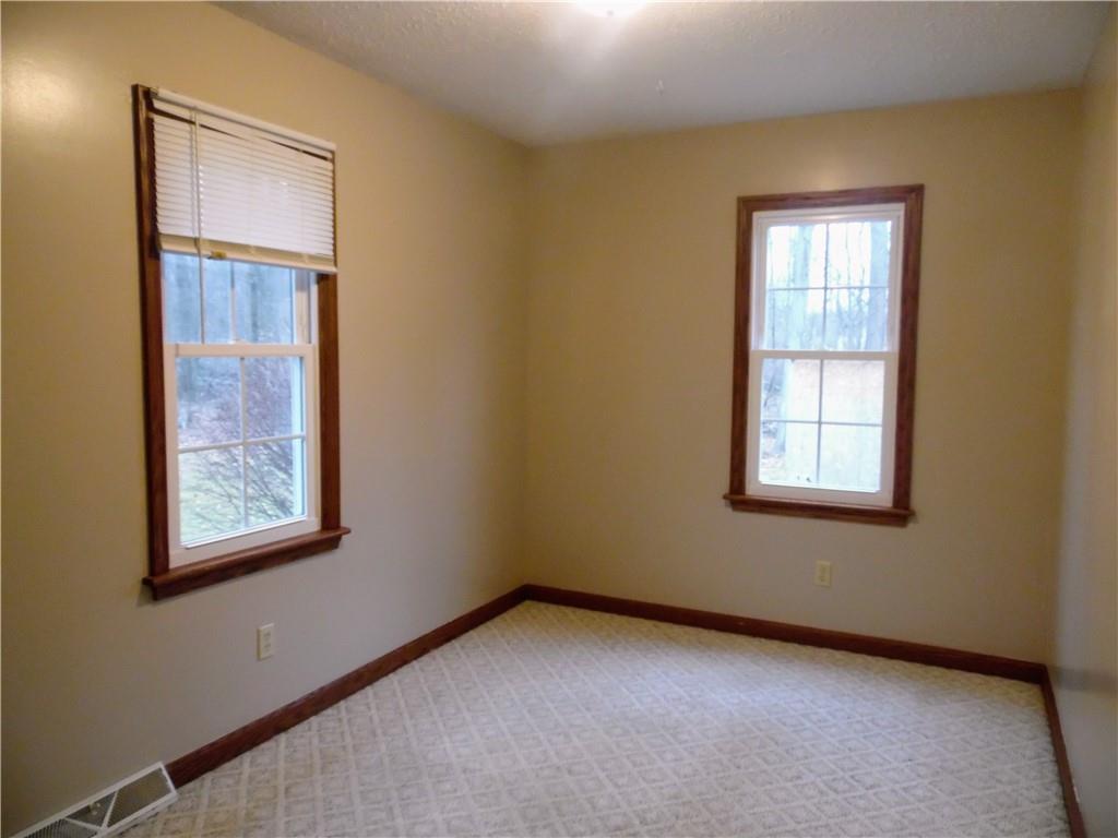 497 Tanglewood Road Pulaski, PA 16143 - Photo 8 of 20 a view of an empty room with a window