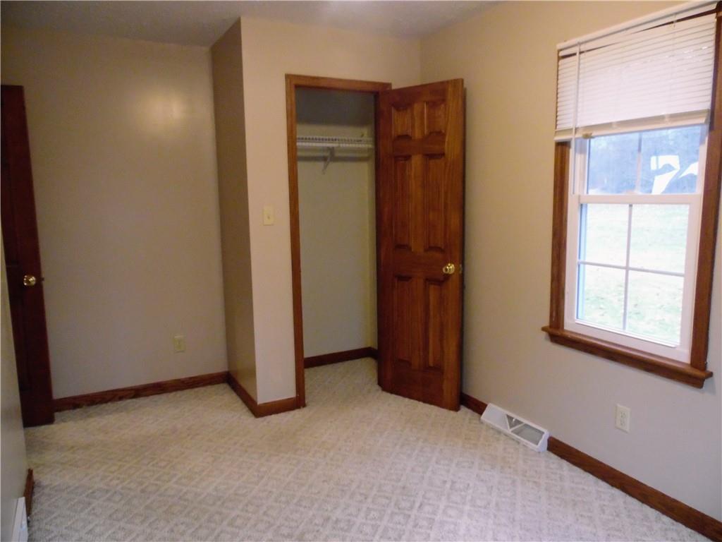 497 Tanglewood Road Pulaski, PA 16143 - Photo 9 of 20 an empty room with windows and closet