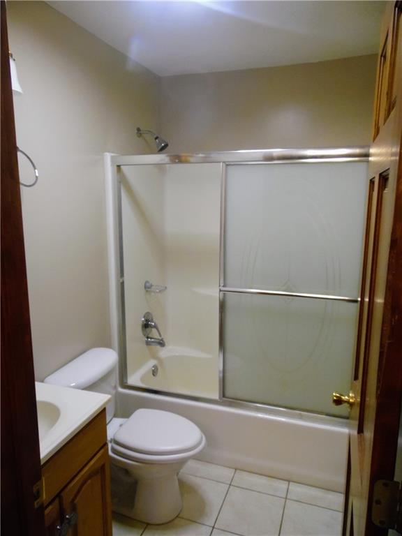 497 Tanglewood Road Pulaski, PA 16143 - Photo 10 of 20 a bathroom with a toilet and a shower