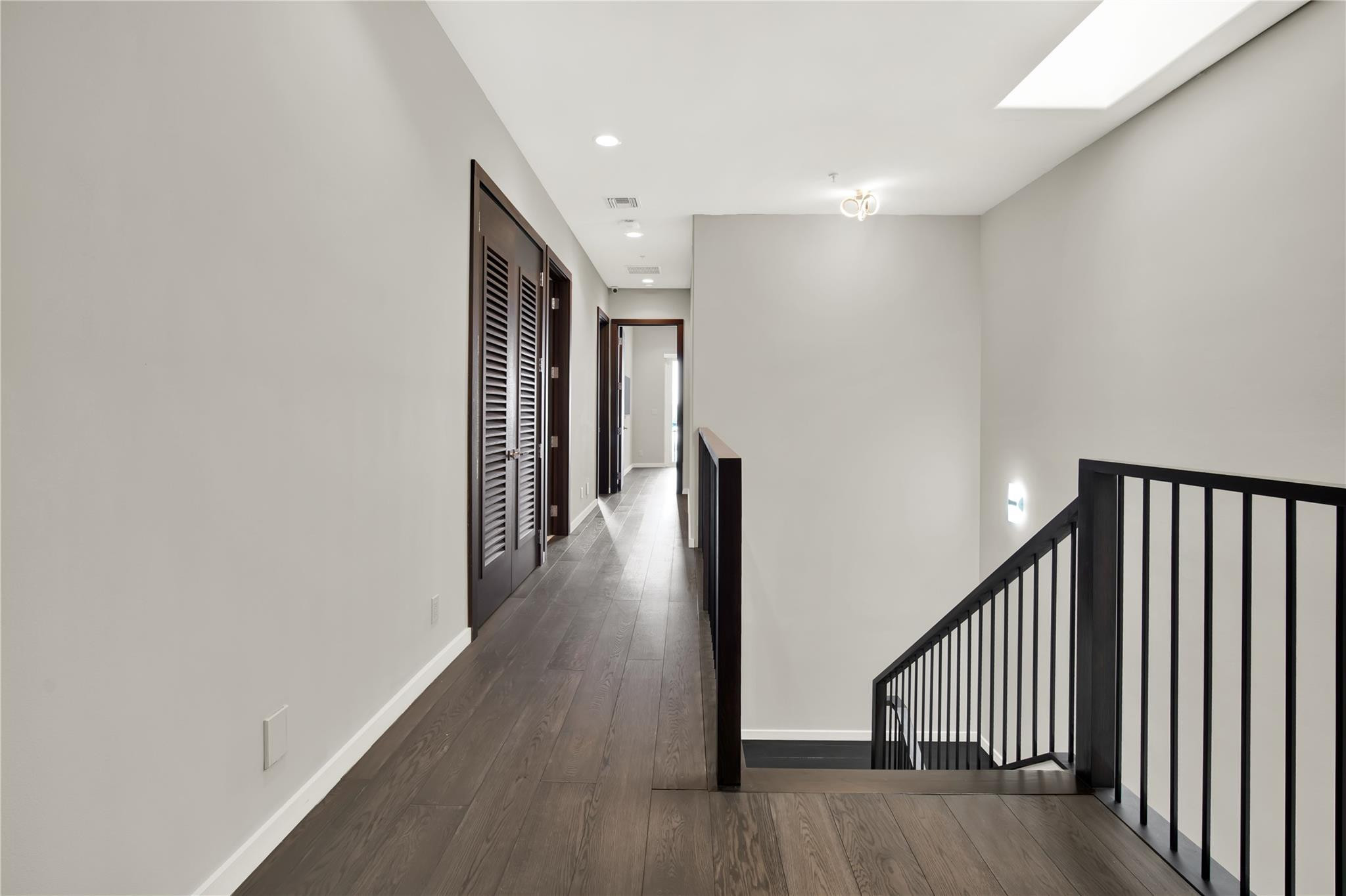 425 North Ocean Boulevard, Unit 3 Boca Raton, FL 33432 - Photo 48 of 69 a view of a hallway with wooden floor and stairs