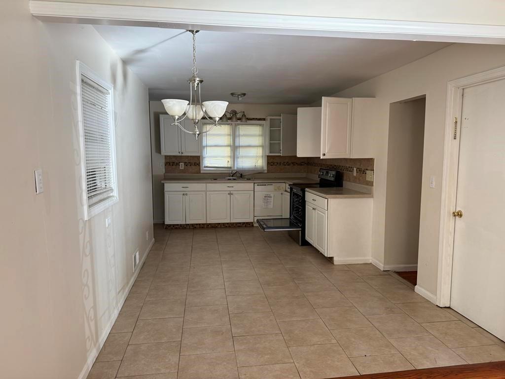 106 Flippen Road Stockbridge, GA 30281 - Photo 4 of 16 a kitchen with a sink and refrigerator