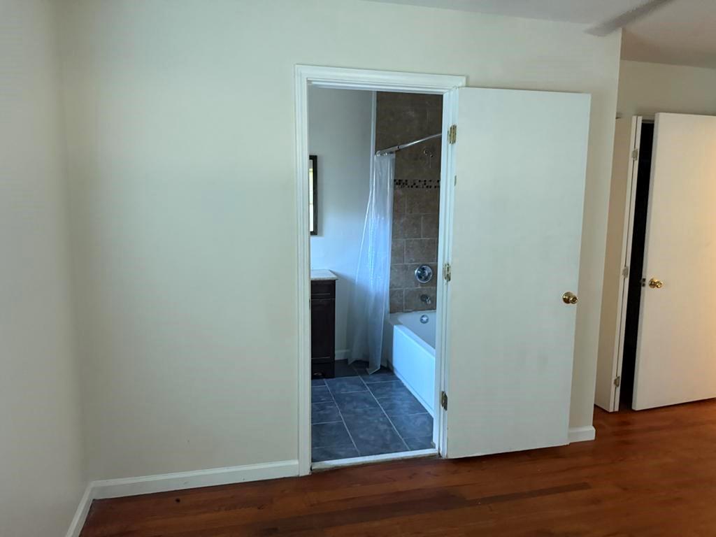 106 Flippen Road Stockbridge, GA 30281 - Photo 8 of 16 a view of a hallway with wooden floor