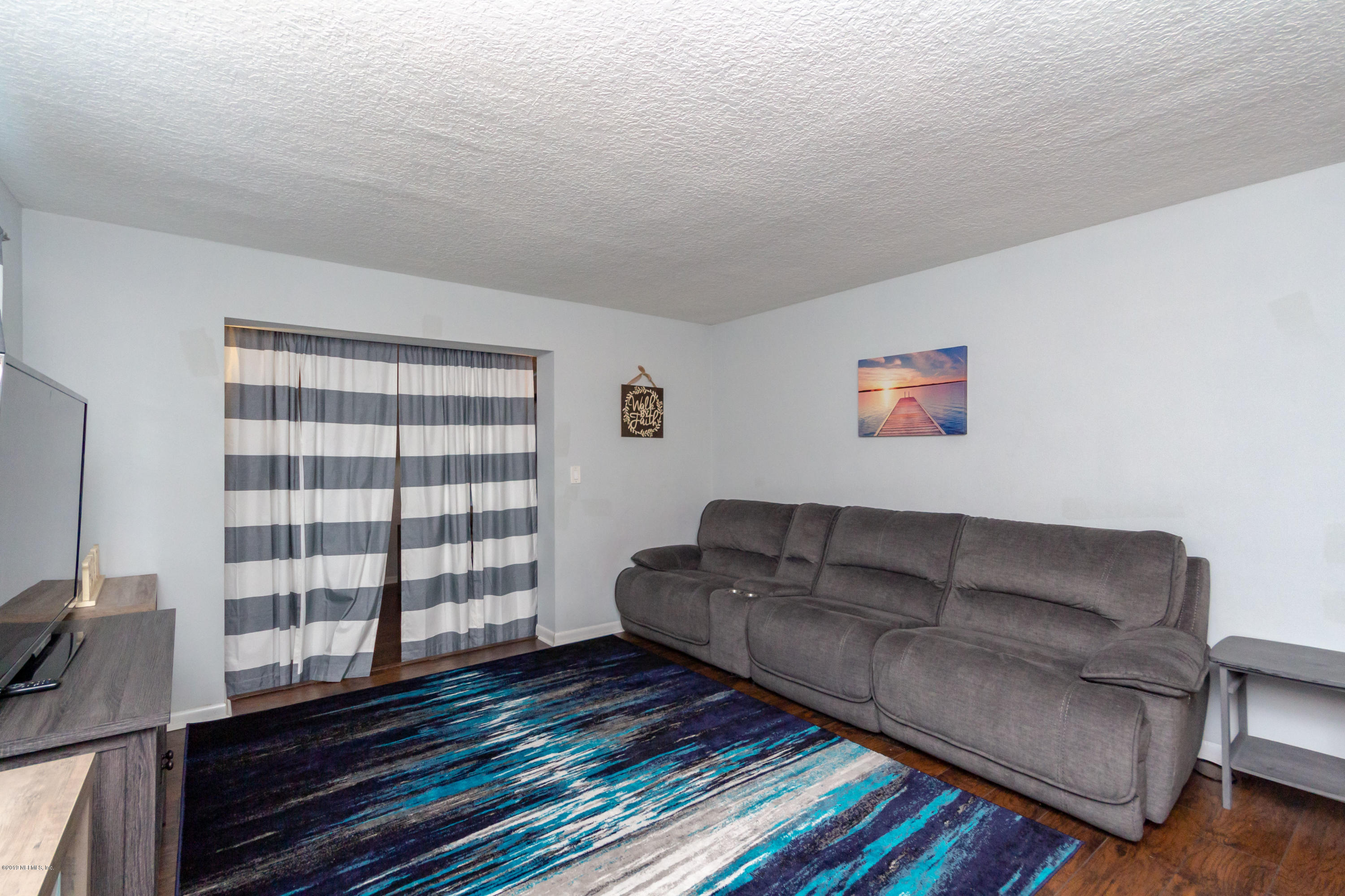 3227 Rogero Road Jacksonville, FL 32277 - Photo 4 of 27 Living Room View 2