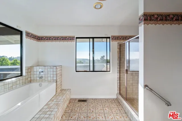 a view of a balcony with wooden floor