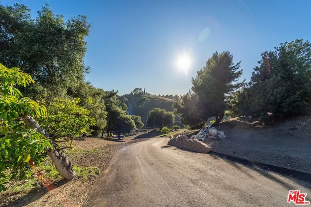 a view of a road with a yard