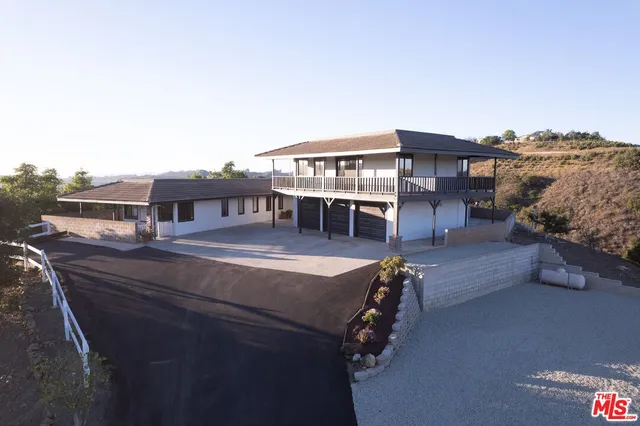 a terrace of a house with outdoor seating