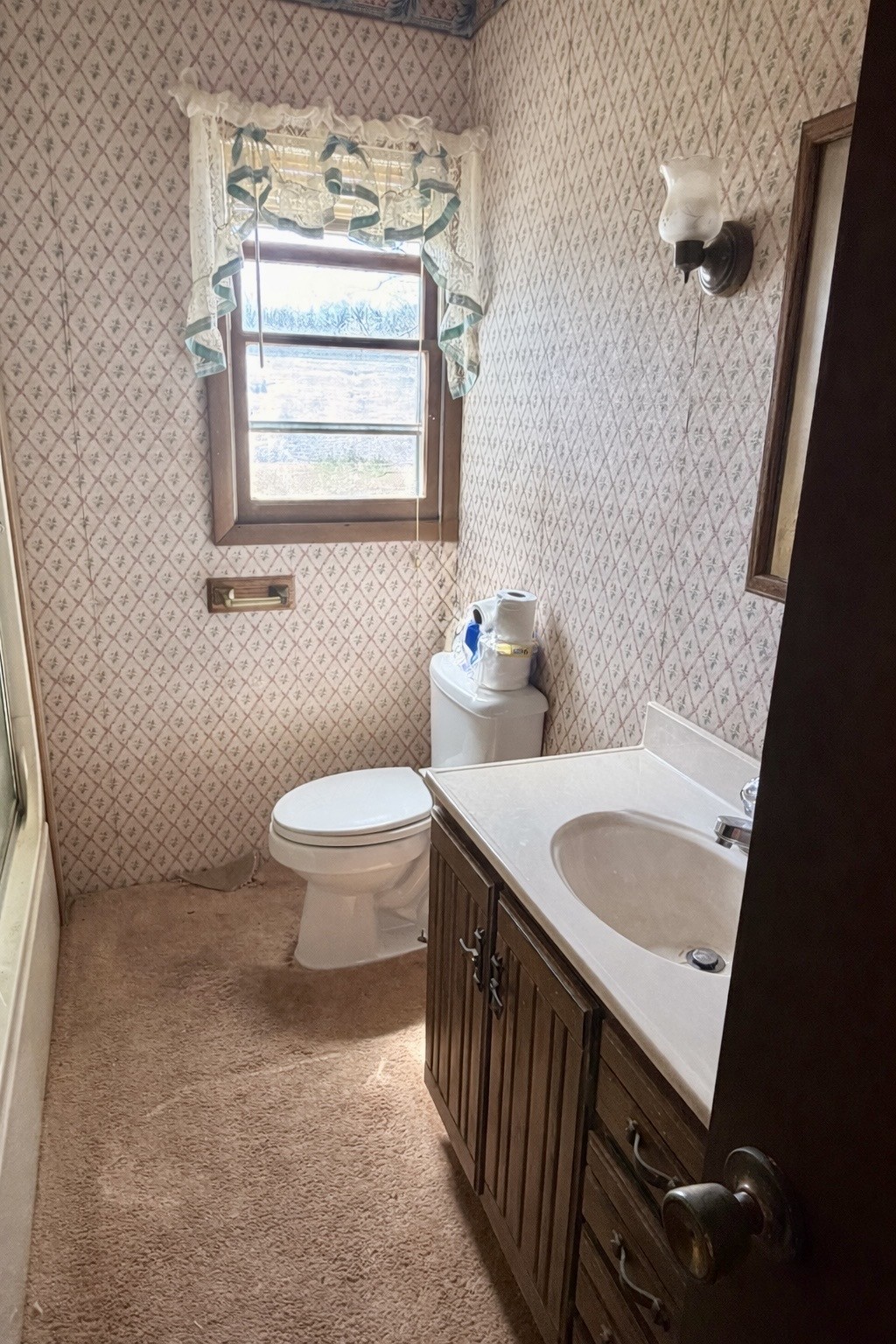 3152 Tanyard Hill Road Lynchburg, TN 37352 - Photo 12 of 14 a bathroom with a granite countertop sink a toilet and a window