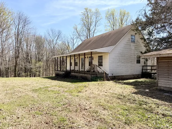 a house with trees in the background