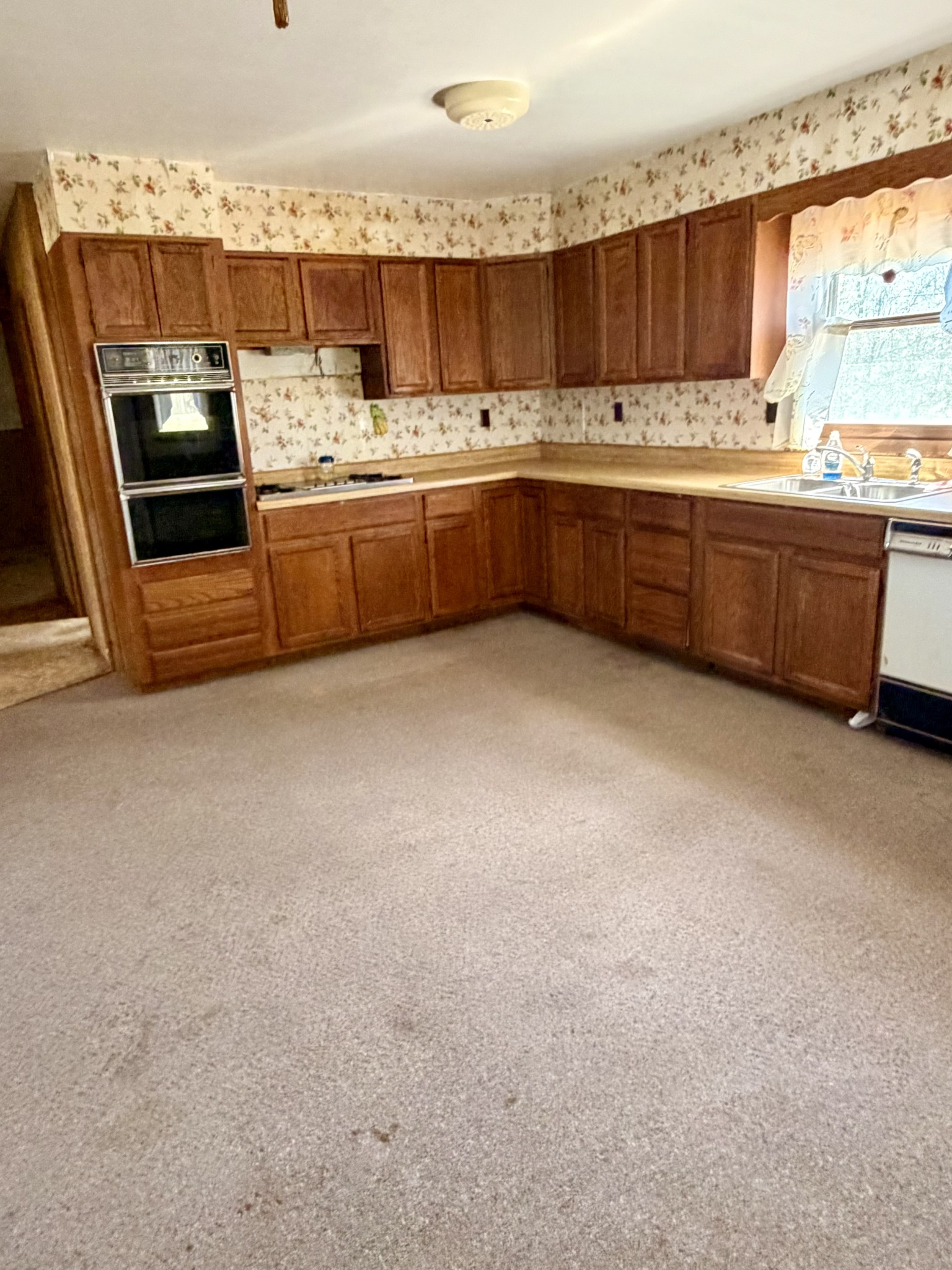 3152 Tanyard Hill Road Lynchburg, TN 37352 - Photo 8 of 14 a open kitchen with granite countertop a sink and a stove
