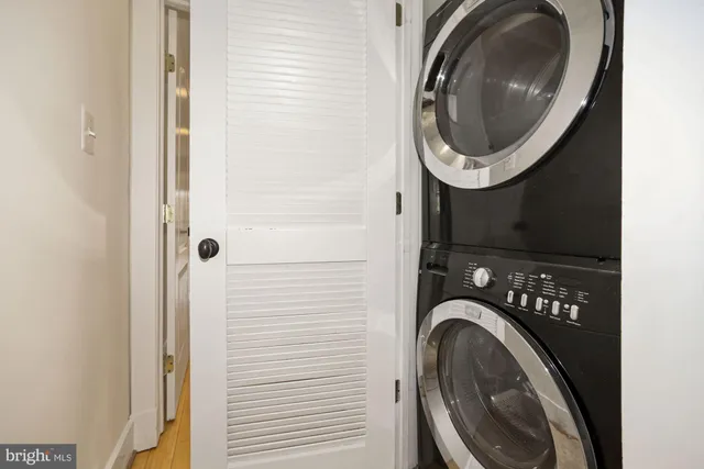 a close view of a utility room with dryer and washer