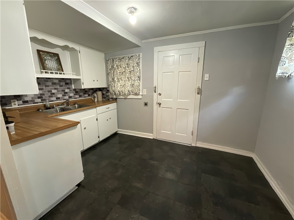 2507 Morris Street Corpus Christi, TX 78405 - Photo 6 of 16 a kitchen with white cabinets and white appliances