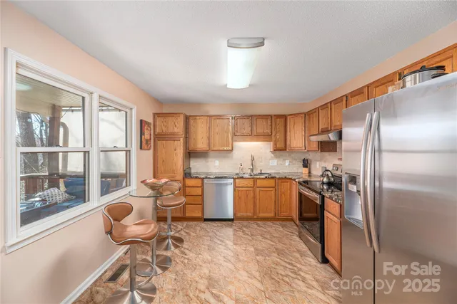 a kitchen with a sink cabinets and appliances