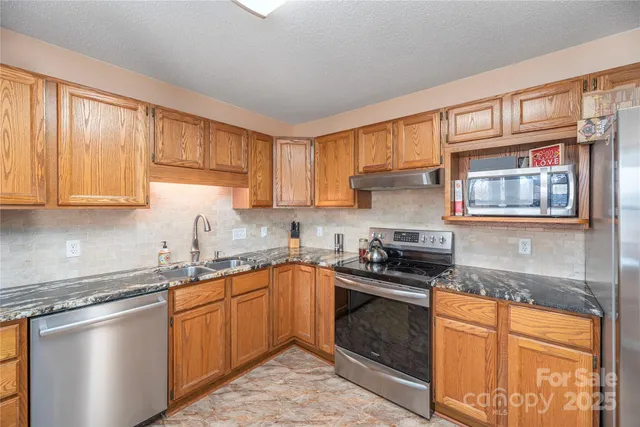 a view of a livingroom with furniture and windows
