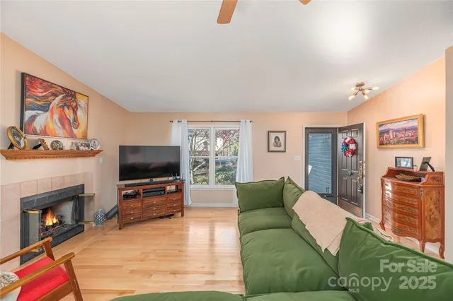 a living room with furniture and a flat screen tv