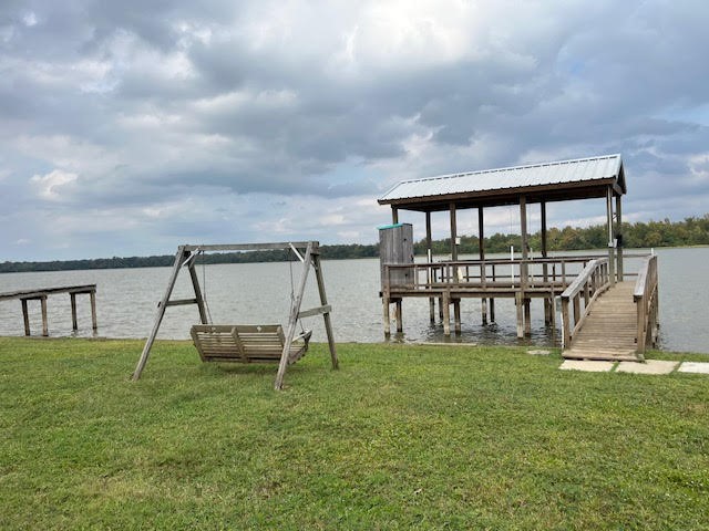 12 Walnut Bend Huntsville, TX 77320 - Photo 12 of 16 a view of a swimming pool with a yard