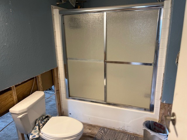 12 Walnut Bend Huntsville, TX 77320 - Photo 8 of 16 a white toilet sitting next to a shower