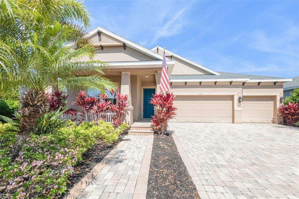 5116 Coastal Scene Drive Apollo Beach, FL 33572 - Photo 1 of 36 a front view of a house with a porch