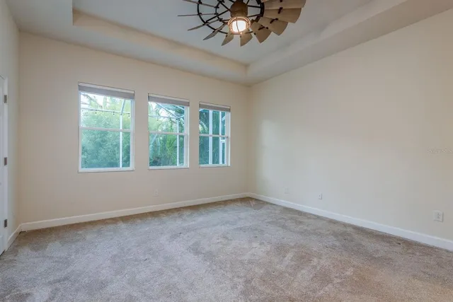 a view of an empty room with a chandelier