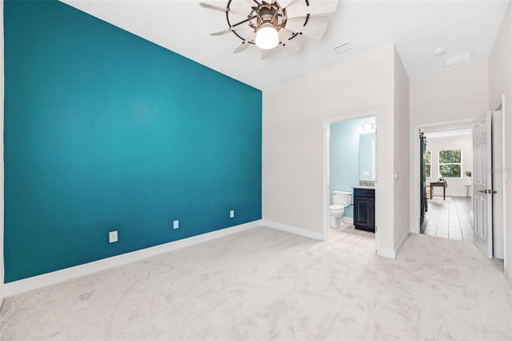 5116 Coastal Scene Drive Apollo Beach, FL 33572 - Photo 25 of 36 an empty room with chandelier fan