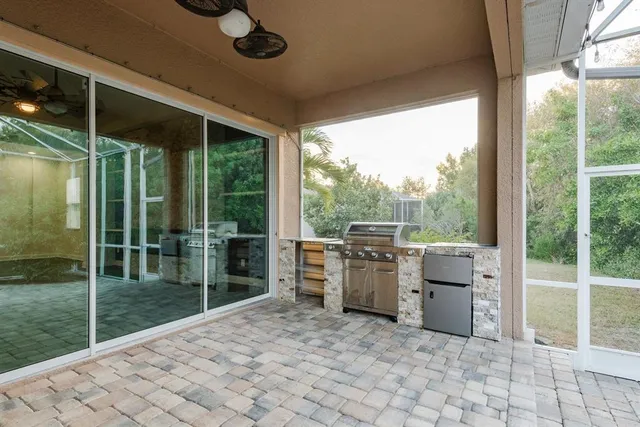 a view of a backyard with a tub and wooden floor