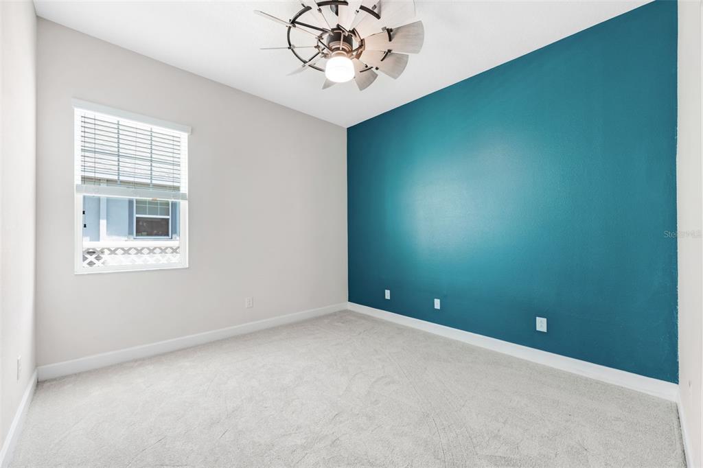 5116 Coastal Scene Drive Apollo Beach, FL 33572 - Photo 27 of 36 an empty room with a fan