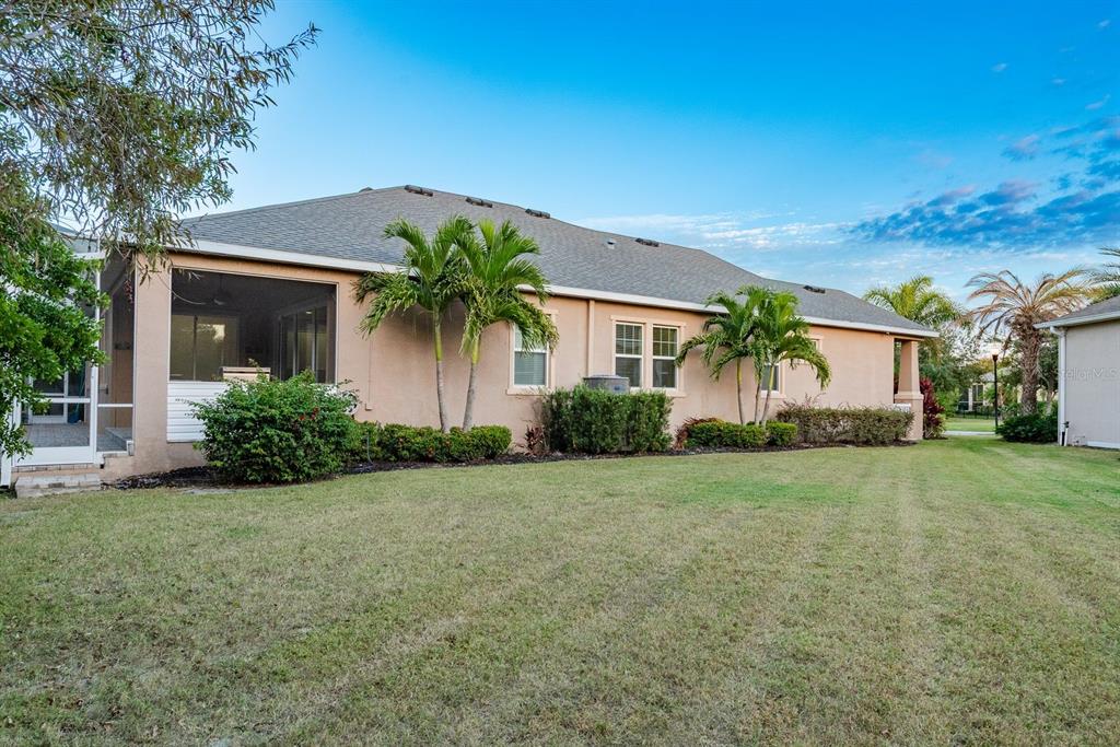 5116 Coastal Scene Drive Apollo Beach, FL 33572 - Photo 31 of 36 front view of a house with a yard